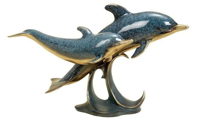 Dolphins in the shape of an amulet of love
