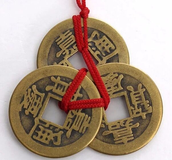 Coins with a red thread for good luck